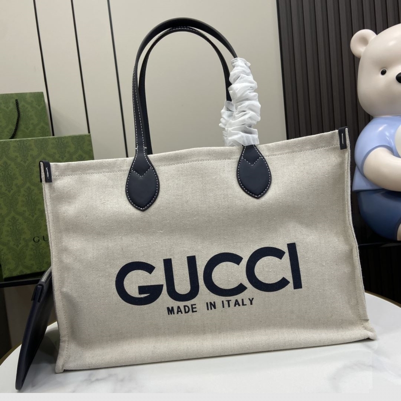 G*u*i shopping bags